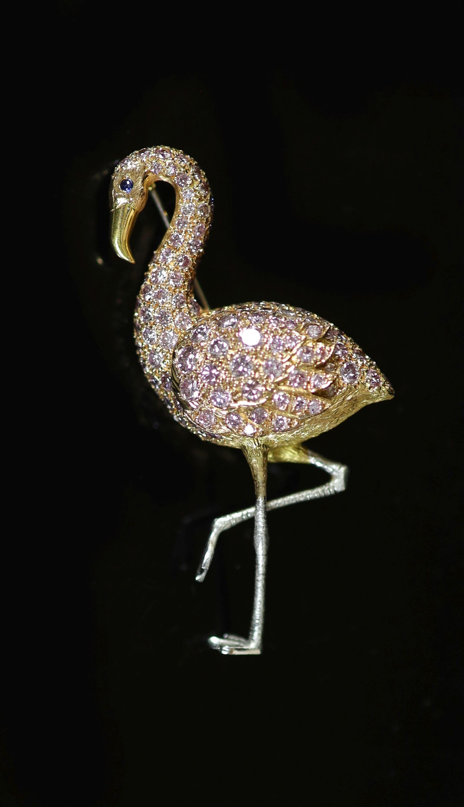 A modern two colour 18ct gold and diamond encrusted brooch, modelled as a flamingo